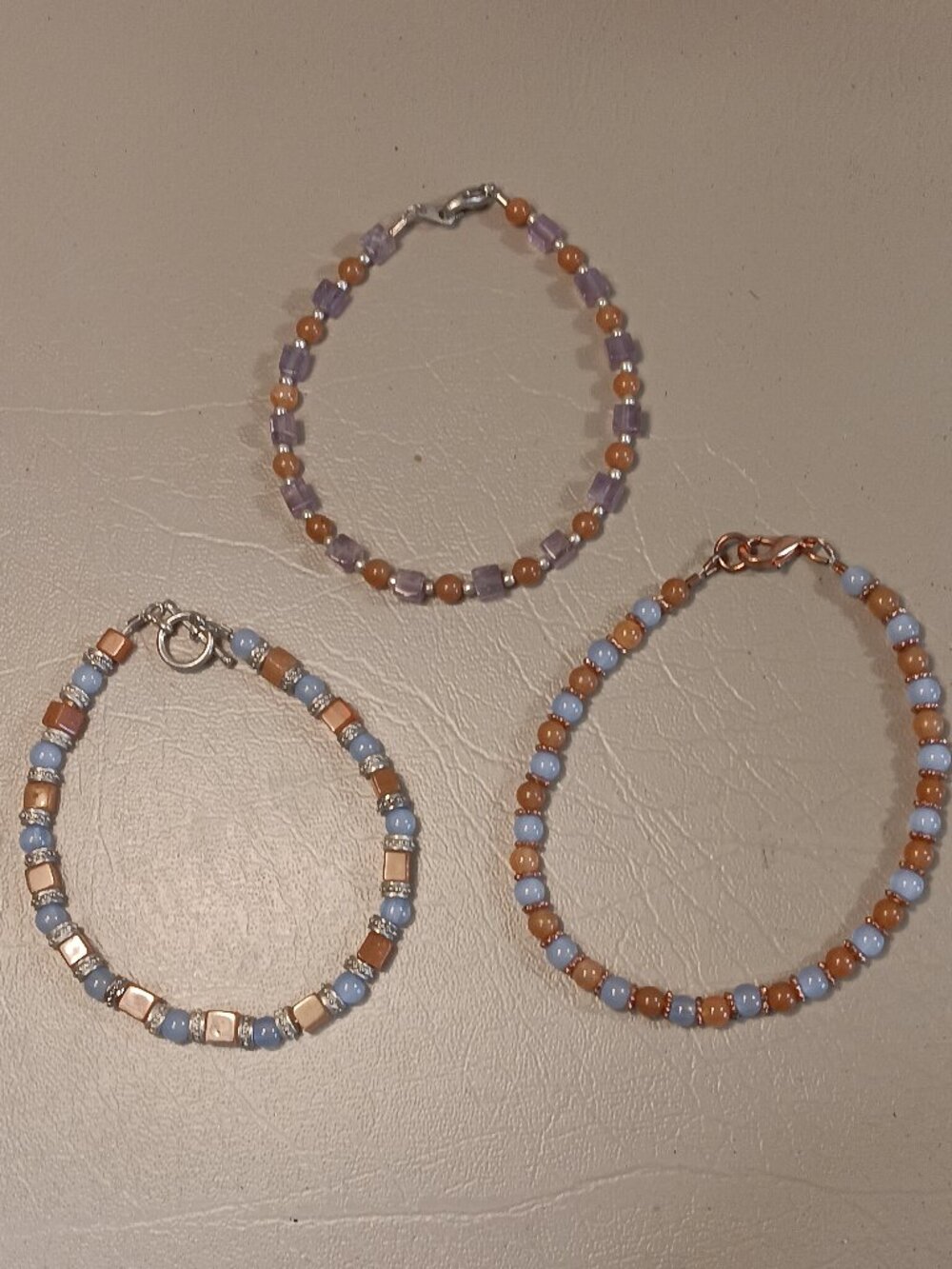 Lot of 3 stone bead bracelets pale blue light orange purple tones